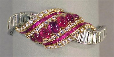 Lot 634 - Diamond and Ruby Bracelet Platinum and 18 kt....