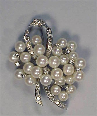 Lot 412 - Diamond and Cultured Pearl Bow Pin 14 kt....