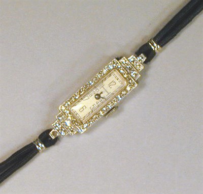 Lot 118 - Lady's Diamond Wristwatch The black cord band...