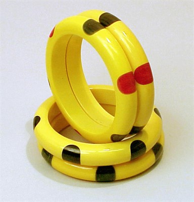 Lot 286 - Group of Four Bakelite Dot Bracelets Each in...