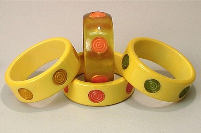 Lot 285 - Group of Four Bakelite Bracelets Each in...