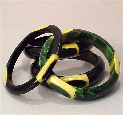 Lot 288 - Group of Four Bakelite Dot Bracelets Each with...