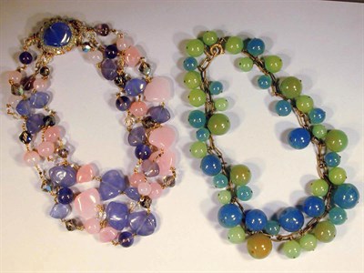 Lot 133 - Two Glass Bead Necklaces The first a green and...