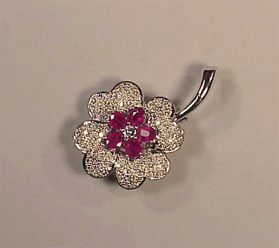 Lot 284 - Ruby and Diamond Flower Pin 18 kt. white gold,...