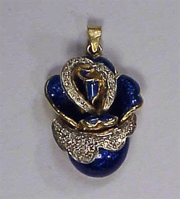 Lot 147 - Diamond and Enamel Flower Pendant 18 kt....