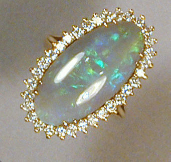 Lot 448 - Opal and Diamond Ring 18 kt. yellow gold, set...