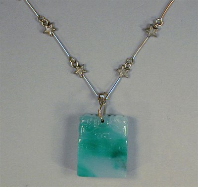 Lot 58 - Jade Pendant and Chain The carved jade chop...