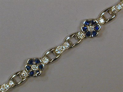 Lot 513 - Diamond and Sapphire Bracelet Platinum, the...