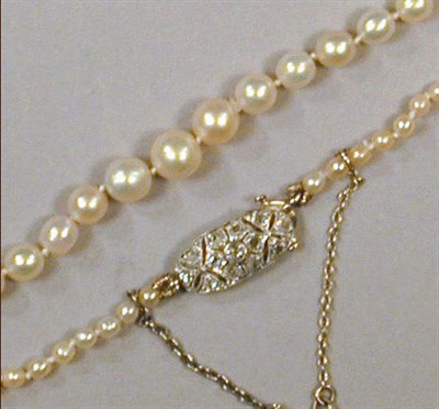 Lot 429A - Natural Pearl Necklace The single strand...
