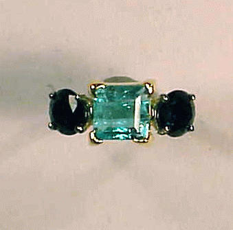 Lot 159 - Emerald and Sapphire Ring The platinum shank...