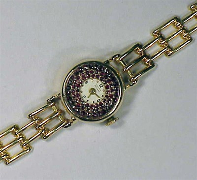 Lot 153 - Lady's Gold and Garnet Wristwatch 14 kt....