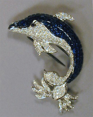 Lot 551 - Sapphire and Diamond Dolphin Pin 18 kt. white...