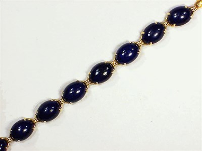 Lot 117 - Gold and Lapis Lazuli Bracelet The flexible...