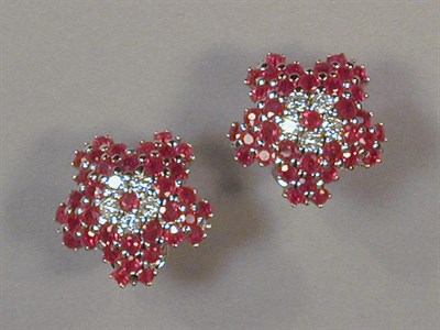 Lot 523 - Pair of Ruby and Diamond Flowerhead Earrings...