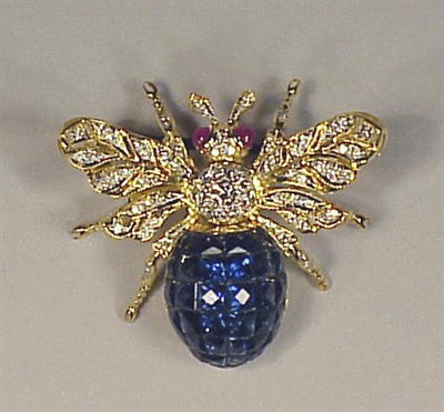 Lot 230 - Diamond, Ruby and Sapphire Pin 18 kt. yellow...
