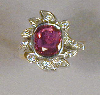 Lot 480 - Pink Sapphire and Diamond Ring The 18 kt....