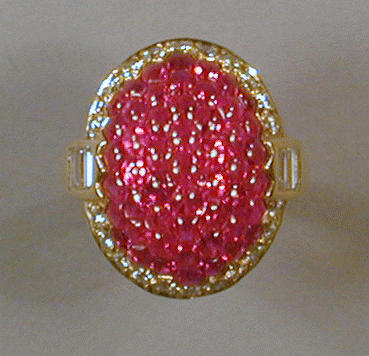 Lot 483 - Cabochon Ruby and Diamond Ring 18 kt. yellow...