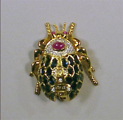 Lot 229 - Diamond, Ruby and Sapphire Bug Pin 18 kt....