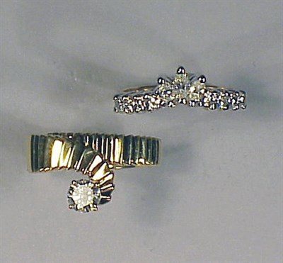 Lot 241 - Two Gold and Diamond Rings The 18 kt. yellow...