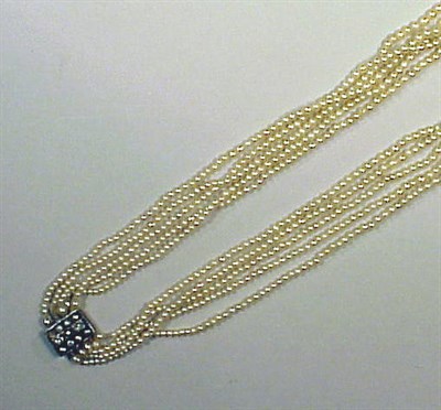 Lot 235 - Multistrand Natural Pearl Necklace The five...
