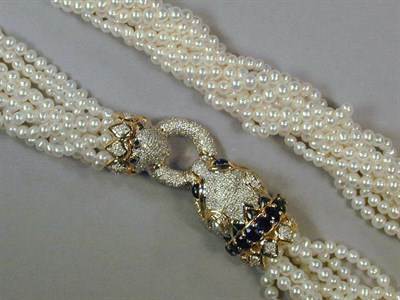 Lot 552 - Multistrand Cultured Pearl Torsade The clasp...