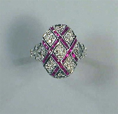 Lot 292 - Ruby and Diamond Ring 14 kt. white gold, the...