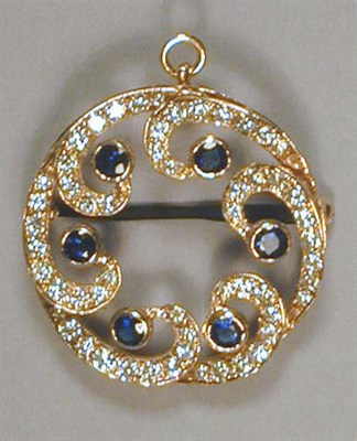 Lot 454 - Diamond and Sapphire Pin/Pendant 14 kt. yellow...
