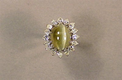 Lot 473 - Chrysoberyl Cat's-Eye and Diamond Ring...