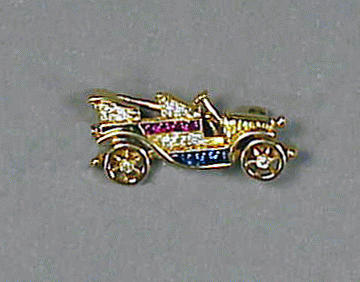 Lot 121 - Gold, Diamond and Multicolored Stone Car Pin...