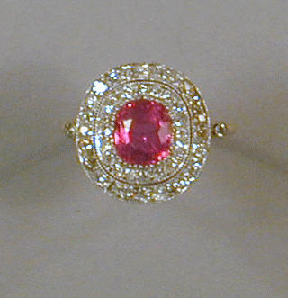 Lot 512 - Ruby and Diamond Ring The 18 kt. yellow gold...