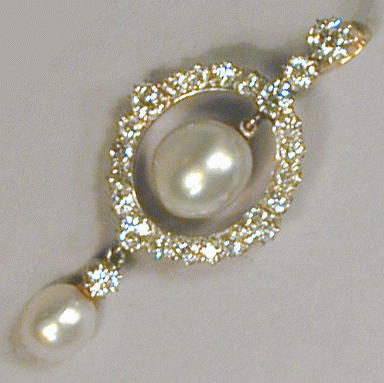 Lot 508 - Natural Pearl and Diamond Pendant 18 kt....