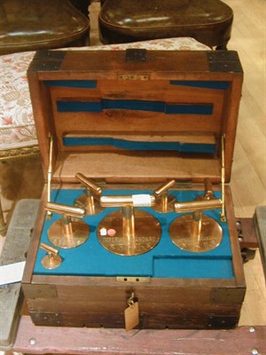 Lot 343 - Set of English Brass Weights Fitted in an Iron-...