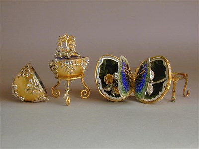 Lot 729 - Two Gilt and Sterling Silver Eggs on Stands