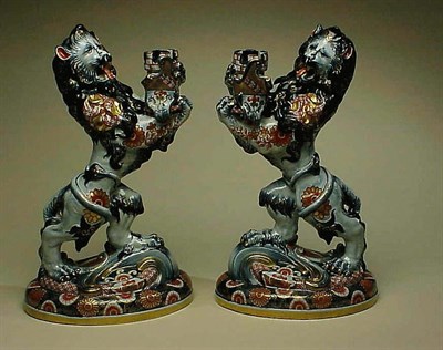 Lot 480 - Pair of Pottery Figural Candlesticks Each in...