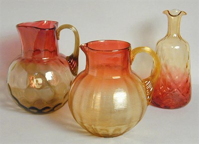 Lot 254 - Two Amberina Glass Pitchers One with quilted...