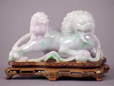 Lot 121 - Chinese Mottled Green Jade Carving of a Fu Lion
