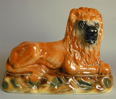 Lot 557 - Pair of Staffordshire Pottery Lions