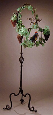 Lot 512 - Wrought Iron and Glass Floor Lamp The twisted...