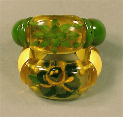 Lot 404 - Two Bakelite Reverse Carved and Painted...