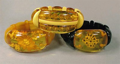 Lot 465 - Group of Three Bakelite Reverse Carved and...