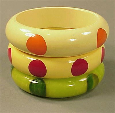 Lot 399 - Group of Three Bakelite Dot Bracelets Each in...