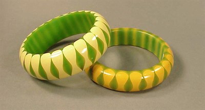 Lot 406 - Two Bakelite Bow Tie Bracelets Each in green...