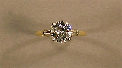 Lot 225 - Diamond Engagement Ring The 14 kt. yellow gold...