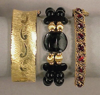 Lot 142 - Three Gold Bracelets 14 kt. yellow gold,...