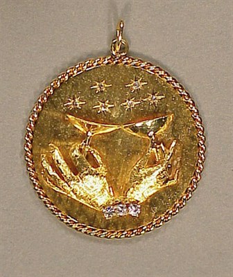 Lot 131 - Gold and Diamond Charm 14 kt. yellow gold, of...