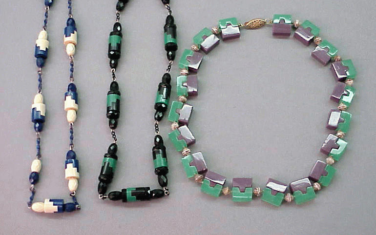 Lot 84 - Three Art Deco Puzzle Piece Necklaces...