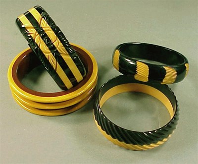 Lot 459 - Group of Four Bakelite Two-Color Bracelets One...