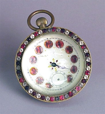 Lot 429 - Glass Ball Clock The outside rim set with red...