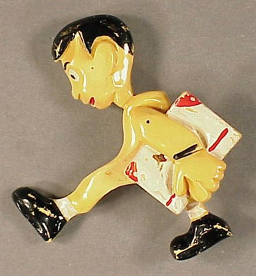 Lot 476 - Bakelite Pivoting Brooch Depicting a boy...