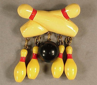 Lot 474 - Bakelite Brooch Depicting two bowling pins...